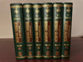 Spines of all six green-and-gold Darussalam Explanation of Riyad-us-Saliheen hardback volumes.